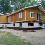 24x50ft cottage in Point Clark was sinking in the back corner. Cottaged rolled out of the way for new full height foundation was poured.