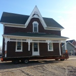 Farm house built in the 1860s made with Insulbrick 25x34ft was sold to neighbour and moved to a nearby farm. Loaded and ready for move day.