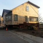 House 30x40ft was relocated 10 blocks away from downtown Kincardine along the river. Land used for a teaching school/office. Loading the house on the dollies (wheels).