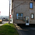 House 30x40ft was relocated 10 blocks away from downtown Kincardine along the river. Land used for a teaching school/office. House being navigated down tight streets past hydro lines.