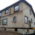 House 30x40ft was relocated 10 blocks away from downtown Kincardine along the river. Land used for a teaching school/office. House being navigated down tight streets. House being lowered onto new foundation.