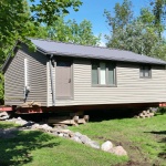 22x32ft cottage raised for new foundation in Inverhuron.