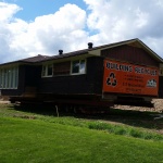 Single ranch bugalow (34x42ft) relocated from one end of Walkerton to the other side because of a housing complex development for seniors. House loaded ready for move day.