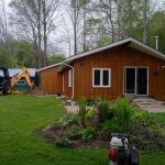 24x50ft cottage in Point Clark was sinking in the back corner. Cottaged rolled out of the way for new full height foundation was poured.