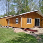 24x50ft cottage in Point Clark was sinking in the back corner. Cottaged rolled out of the way for new full height foundation was poured.