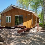 24x50ft cottage in Point Clark was sinking in the back corner. Cottaged rolled out of the way for new full height foundation was poured.