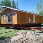 24x50ft cottage in Point Clark was sinking in the back corner. Cottaged rolled out of the way for new full height foundation was poured.