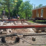24x50ft cottage in Point Clark was sinking in the back corner. Cottaged rolled out of the way for new full height foundation was poured.